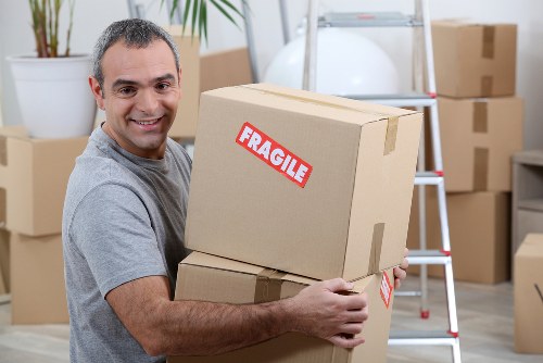 Family house removals in Barnet with labeled moving boxes
