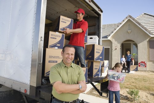 Professional removal van loading boxes and furniture