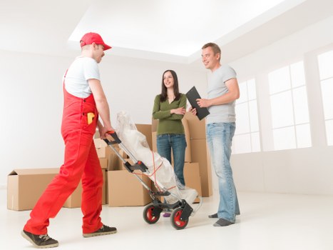 Packed moving boxes and furniture in a Barnet property