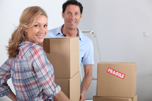 Packed office furniture and labelled boxes ready for relocation