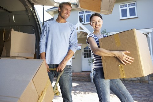 Careful handling of furniture during a property move with safety focus